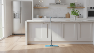 A set of three bright blue and white microfiber mop pads laying on a clean, polished hardwood floor.