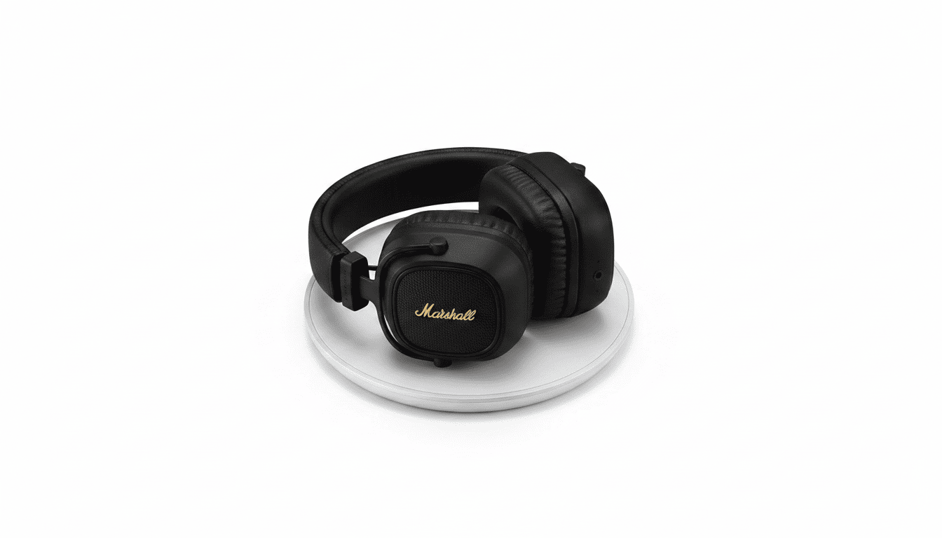 Best on-ear headphones for long battery life in the UK 2026 Marshall Major V headphones placed on a wireless charging pad in a minimalist setting.